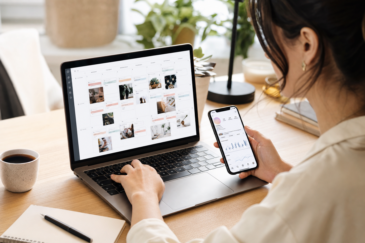 Social media content calendar on laptop with Instagram analytics on smartphone beside it